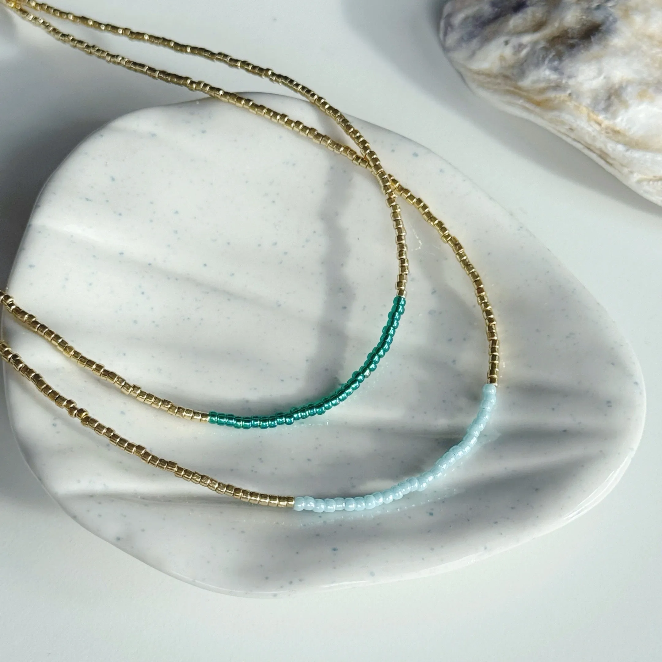 Gold and ocean blue necklaces