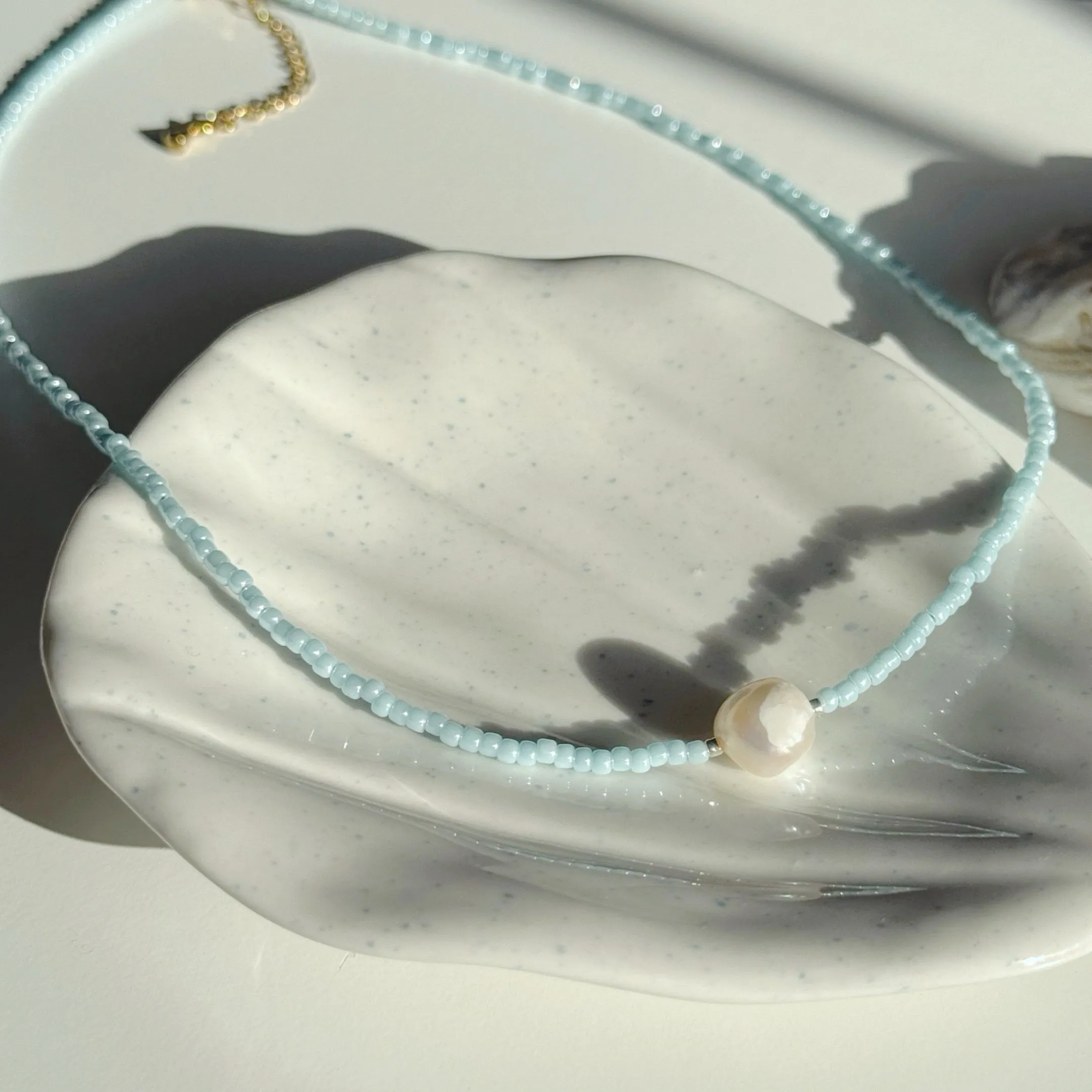 Gold and ocean blue necklaces