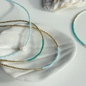 Gold and ocean blue necklaces