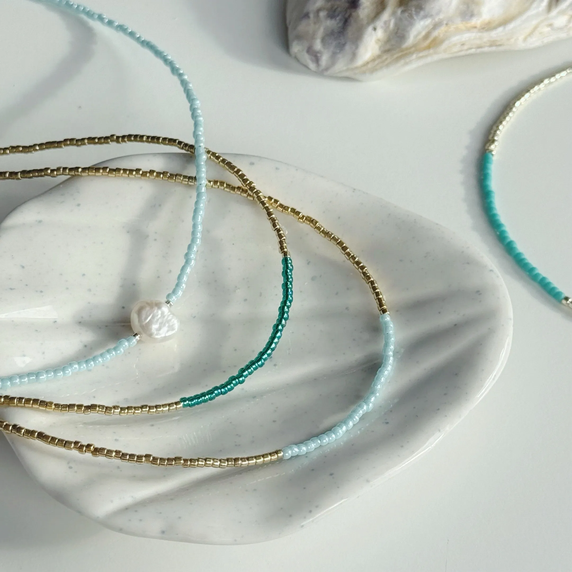 Gold and ocean blue necklaces